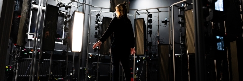 A photo of a Photogrammetry set up with a girl stood in the centre